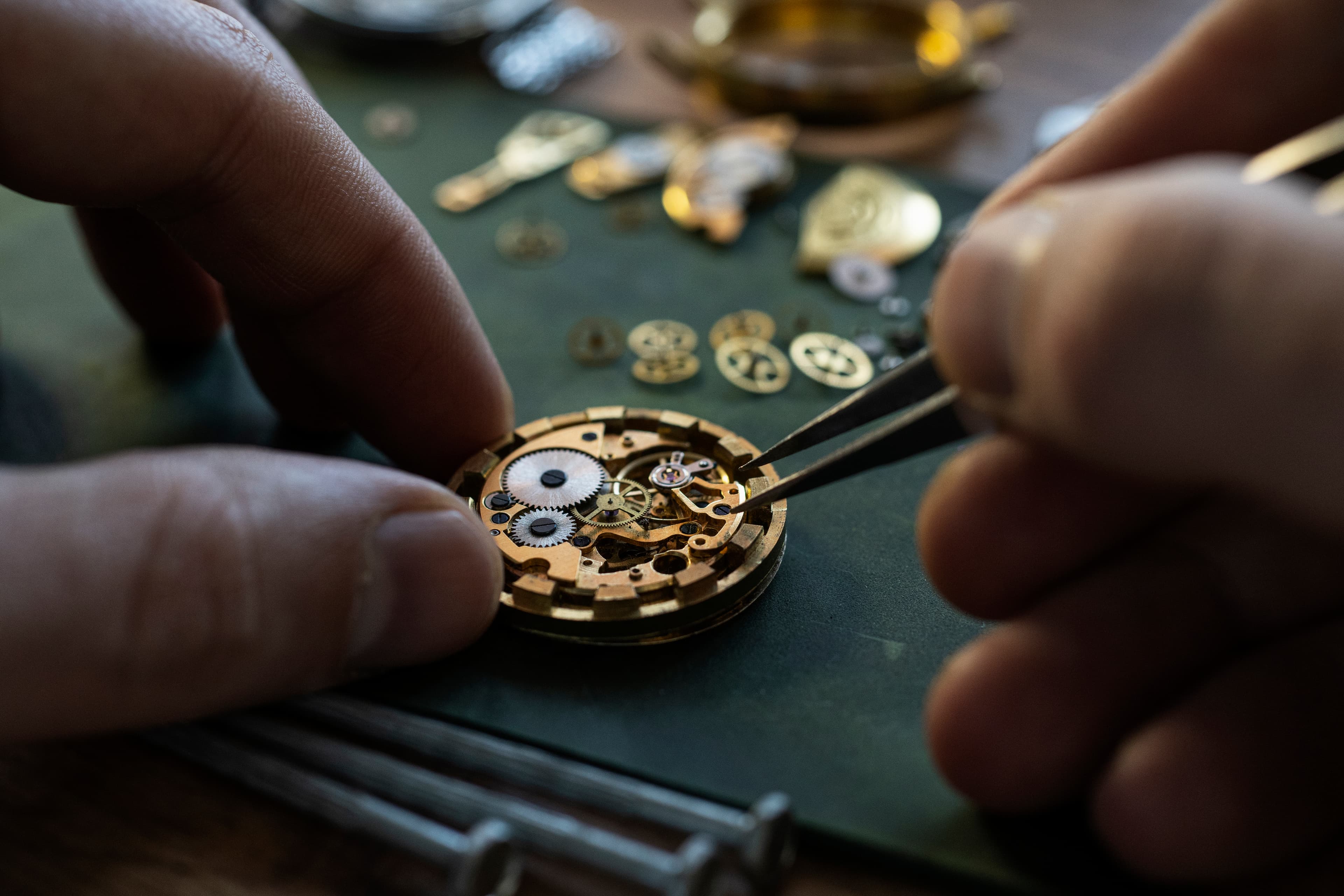 A horologist working on a mechanical watch movement at the BHI.